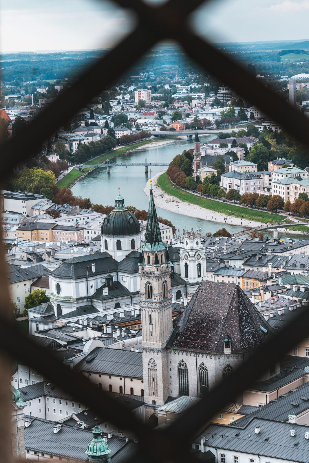 City photo — view over Salzburg through a window
