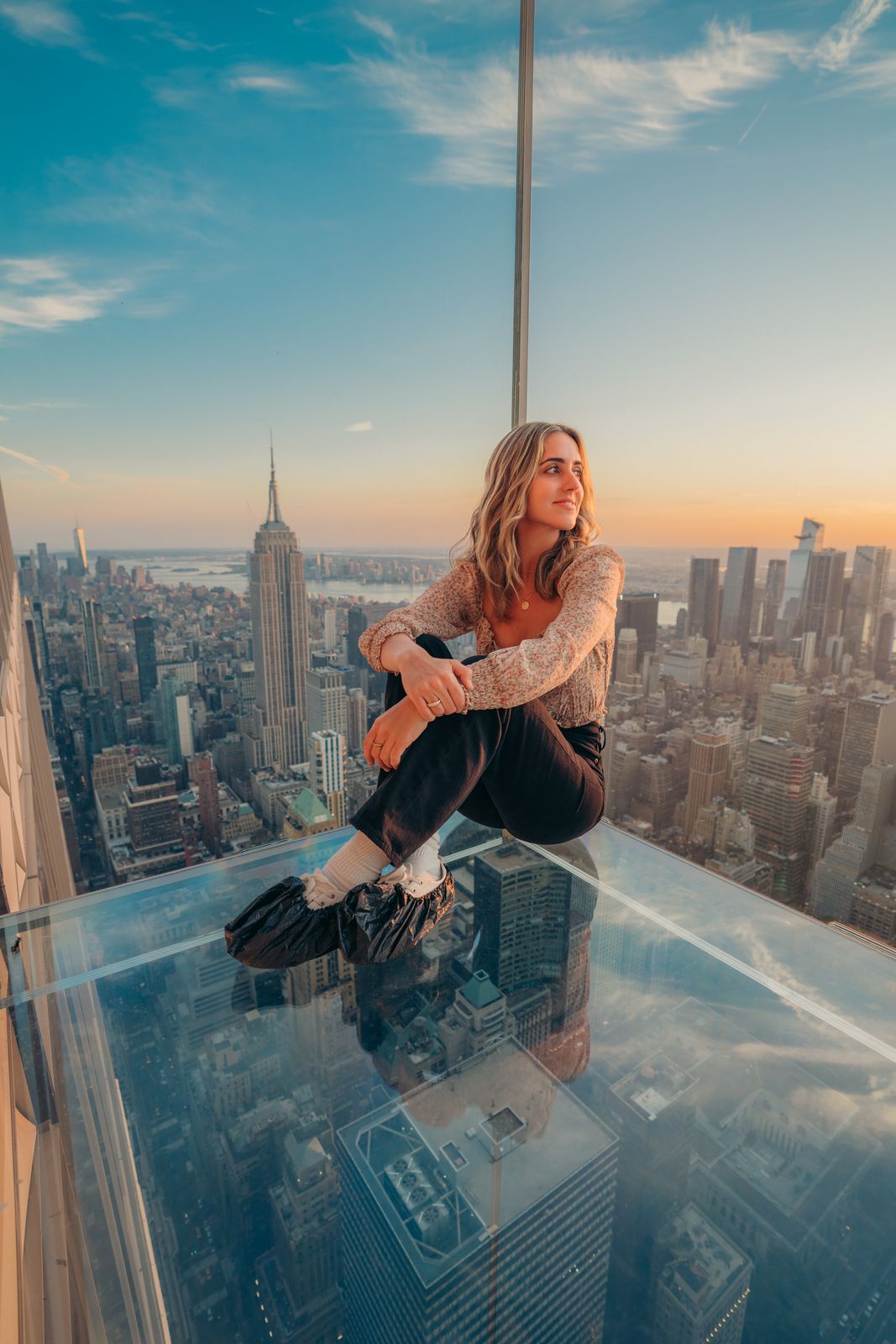 People photo — sitting on the glass skydeck
